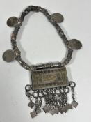 A Omani traditional white metal panel beeded necklace mounted with four Austrian Thaler Maria