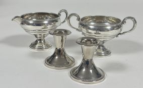 A Crown Sterling silver milk jug and two handled sugar basin of circular form with C scroll