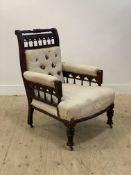 A large Victorian mahogany famed armchair in the style of Christopher Dresser, circa 1870, the