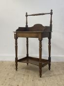 A mid 19th century mahogany country washstand, turned rail back over 3/4 galleried top, raised on