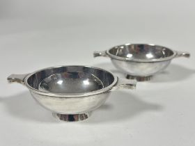 A pair of Hamilton & Inches Edinburgh silver quaiches of plain form, (H x 3cm X D x 7cm)