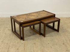 A mid century teak tile top coffee table, with a pair of nesting tables under H40cm, W96cm, D48cm