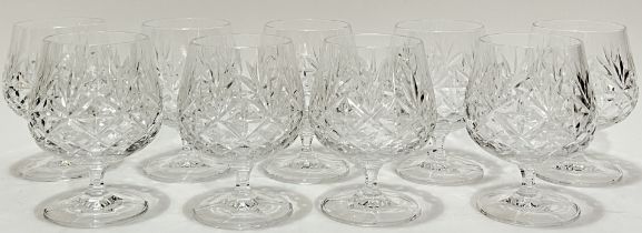 A set of nine cut crystal Brandy glasses (h- 12cm)