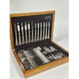 A oak canteen of Oneida Community Epns flatware of thirty eight pieces of Onslow style pattern for