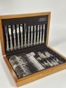 A oak canteen of Oneida Community Epns flatware of thirty eight pieces of Onslow style pattern for