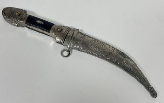 A Eastern white metal plated curved dagger with steel blade and wood mounted handle, (L x 26cm)