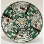 A Japanese porcelain dish with green enameled, panels depicting birds and landscapes. (w-37cm) (