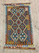 A Chobi kilim rug profusely decorated with geometric design, 168cm x 102cm