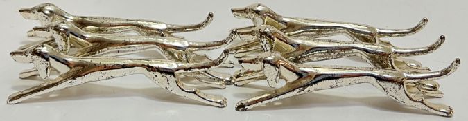 A set of six Art Deco chrome plated knife rests in the form of dogs/hounds (l- 9cm)