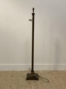 A patinated brass standard lamp formed as a Corinthian column H137cm