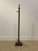 A patinated brass standard lamp formed as a Corinthian column H137cm