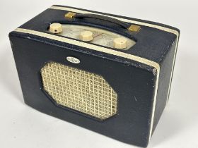 A Large Vintage Roberts Radio set the blue vinyl covered case with cream trim and three white