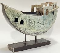 A large contemporary studio pottery model boat and stand, glazed in blue (possibly raku fired) (