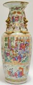 A large Chinese porcelain famille rose Canton vase decorated in polychrome enamels with panels