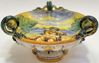 An Italian Maiolica Saca (Castelli?) Istoriato style tin glazed dish on stem foot, depicting Cupid/