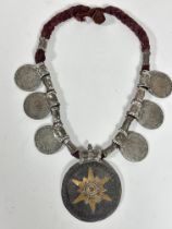 A Omani traditional corded thread necklace with cylinder beaded panels set six Austrian Thaler Maria