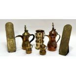 A collection of brass wares comprising two finger plates (l-29.5cm), four middle eastern teapots,