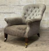 A late 19th century upholstered armchair, the button back and overstuffed seat covered in a pale