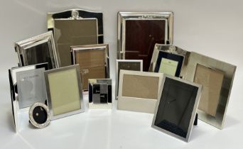 A collection of photo frames comprising a graduated set of three silver plated frames, three various