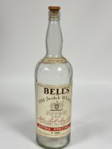 A large Bell's Old Scotch Whiskey display bottle compete with cork top. (H x 52cm X D x 13cm)