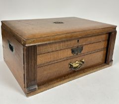 A Edwardian oak canteen fitted lift up top and two fitted drawers containing a part suite of old