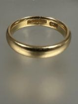 A 18ct gold wedding band, L. 5.2g