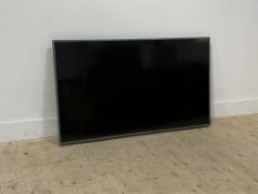 A Hisense flatscreen 54" TV, complete with remote