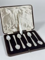 A Set of six mother of pearl Caviar spoons in fitted case retailed by Walker & Hall and a fork, (L x