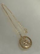 A 9ct gold circular pendant of an archer, (D x 2cm) on 9ct gold chain necklace, (L x 23cm) 4.4g