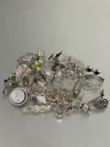 A collection of silver brooches including filegree, Victorian circular panel brooch, earrings,