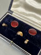 A pair of circular red guilloche enamel buttons, ( D x 1.2cm) and three 9ct gold dress studs, one