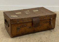 An early 20th century studded leather travelling trunk, the interior fitted with a tray, and