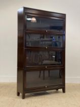 A 1930's mahogany four height stacking bookcase by Gunn H147cm, W87cm, D25cm.