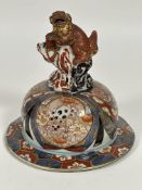 A 19thc Japanese Jar cover decorated in Imari palate with Chrysanthemums and Peonies  enclosed