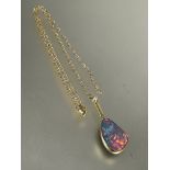 18ct gold mounted pendant set shaped black opal in rub-over setting, (L x 2.5cm x W x 1.5cm) with