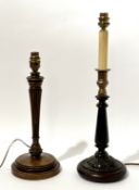 A carved oak table lamp raised on circular base (h-35cm), together with a stained wooded carved