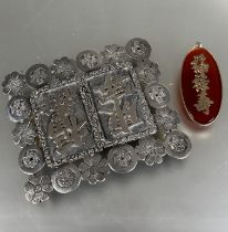 A 1920's Chinese 900 standard two part silver belt buckle with surround of cherry blossom and