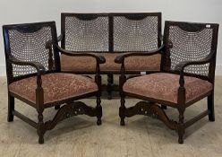 A 1930's three piece walnut and bergere drawing room suite, comprising a pair of armchairs (H84cm,