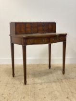 A Georgian style mahogany bonheur du jour writing desk, the super structure with six drawers and two