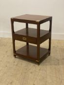 A Campaign style brass bound mahogany two tier side table, 20th century, fitted with a drawer.