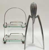 An Italian Alessi lemon juicer (Philippe Starck design) (h- 29.5cm), together with a two-tier cake s