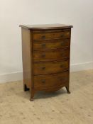 An Edwardian Hepplewhite revival mahogany bow front chest, fitted with a brushing slide above five