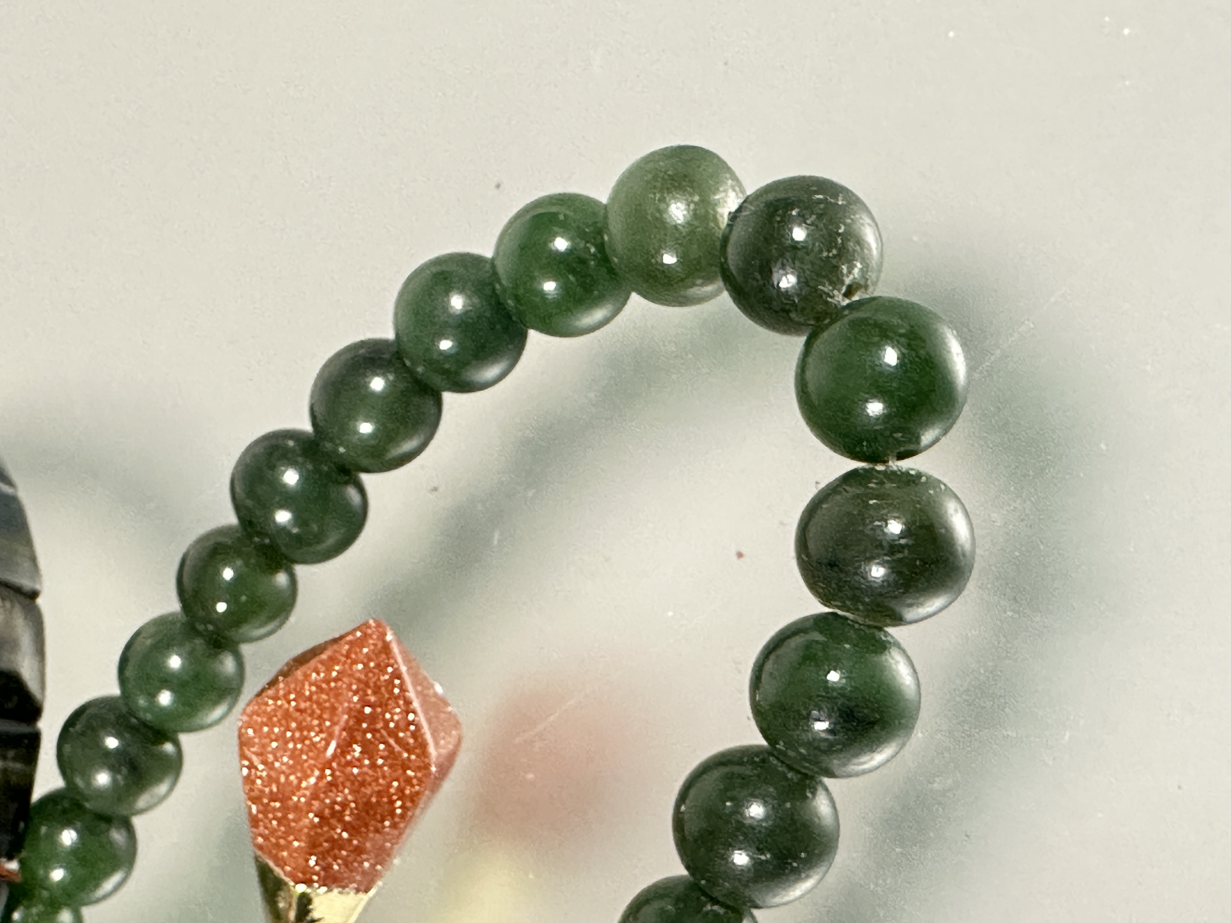 A dark green nephrite jade bead necklace with white metall barrel clasp fastening, (L X 27cm x D x - Image 3 of 3