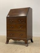 A Georgian style mahogany bureau, early 20th century, the fall front opening to a fitted interior,