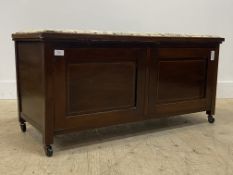 An Edwardian inlaid mahogany ottoman, the upholstered hinged top opening to a plain interior,
