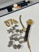 A lady's Seconda gilt metal quartz wristwatch on brown leather strap, a Solvil & Titus gilt metal