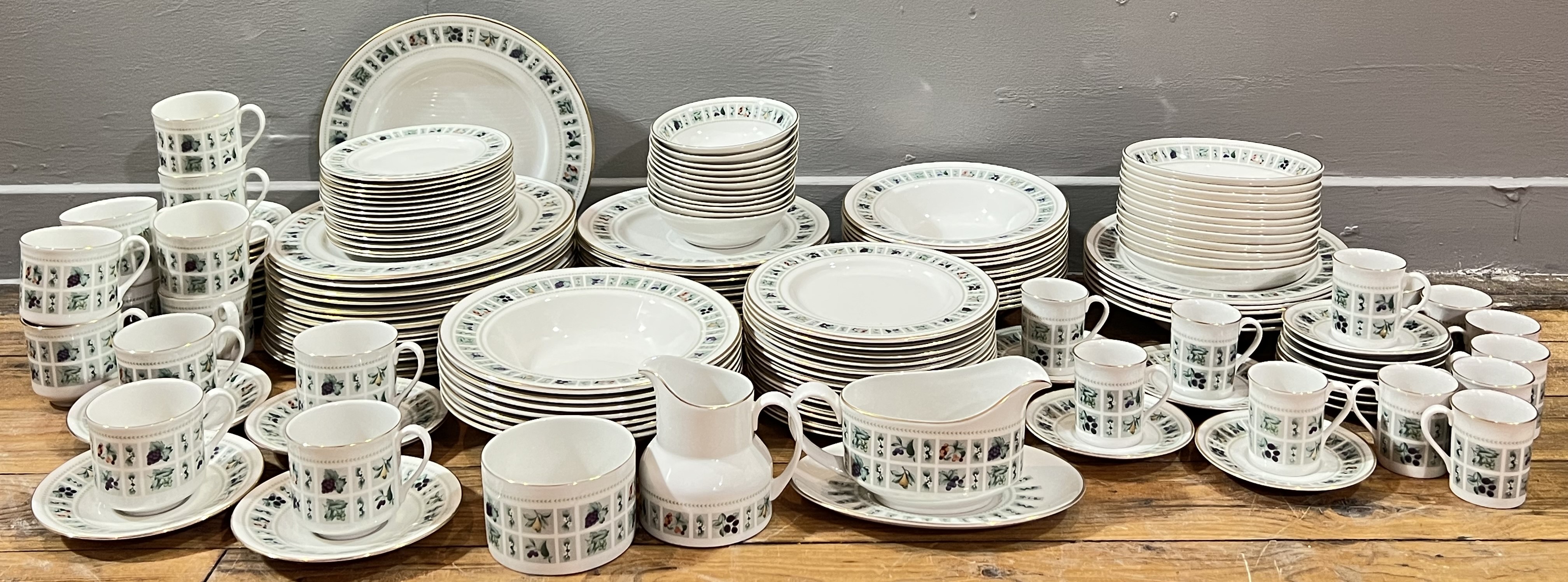 A Royal Doulton 'Tapestry' tea and dinner service with gilt edges and fruit decoration, comprising f