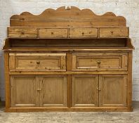 A 19th century Scotch pine dresser, the shaped raised back over four spice drawers, the base with