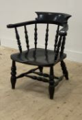 A Victorian black painted elm and fruitwood smokers bow, with  spindle back over shaped seat, raised