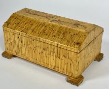 A hand made straw work arched top jewellery box with lift out tray and fitted interior, raised block